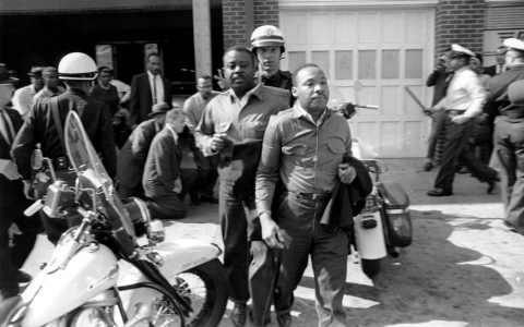 Rev. Ralph Abernathy, left, and Rev. Martin Luther King Jr., right are taken by a policeman as they led a line of demonstrators into the business section of Birmingham, Ala., on April 12, 1963. During his stay in jail, King would pen "Letter From Birmingham Jail," arguably the raison d'être of the civil rights movement.